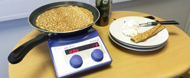 Asynt making pancakes on a hotplate